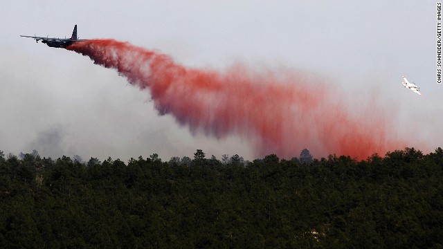  An airplane drops flame retardant over the Black Forest Fire on June 12 near Colorado Springs.