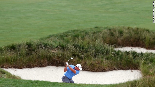 Scott Stallings of the U.S. shoots from a bunker on the 15th hole on June 13.