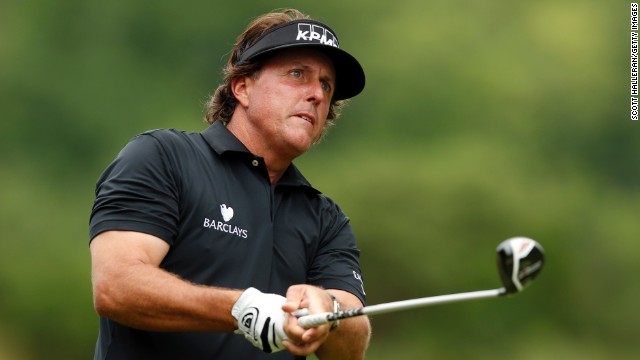 Phil Mickelson of the U.S. watches his shot from the tee of the second hole on June 13.