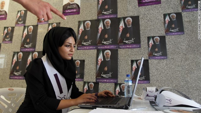 A supporter of Hassan Rouhani, moderate presidential candidate and former top nuclear negotiator, works on her laptop in one of his campaign offices in Tehran on Tuesday, June 11.
