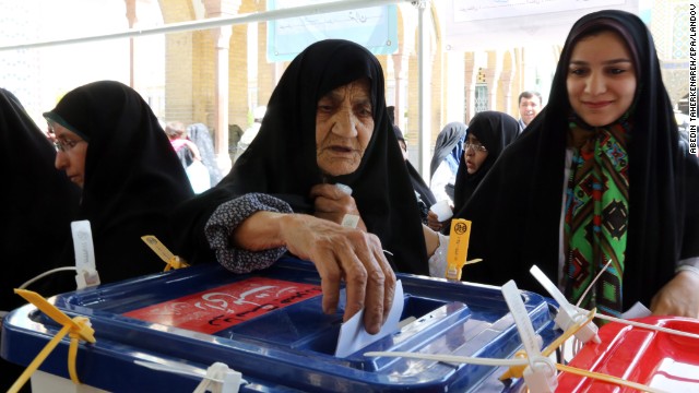 A woman casts her ballot during the Iranian presidential elections in Shahr-e-Rey on June 14.