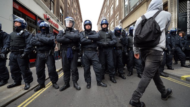 Security is high in London ahead of the G8 summit in Northern Ireland. Riot police stand guard as protests start. 