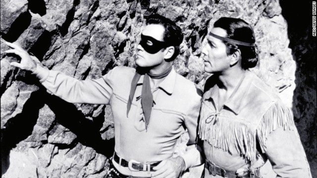 Moore and Silverheels scope out the situation as The Lone Ranger and Tonto.