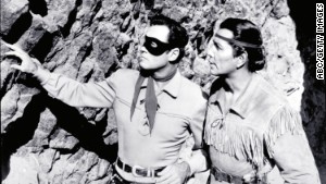 Moore and Silverheels scope out the situation as The Lone Ranger and Tonto.