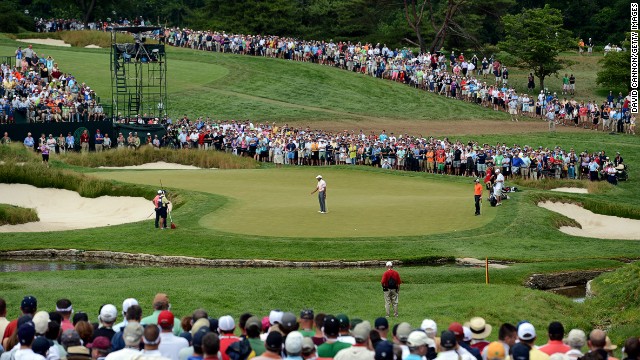 Woods misses a putt for birdie on the ninth hole on June 14.
