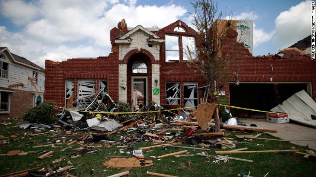 A tornado-damaged home in Forney, Texas, lies in ruin on April 4, 2012. Tornadoes across the greater Dallas-Fort Worth area in early April caused an estimated $1 billion in damage.