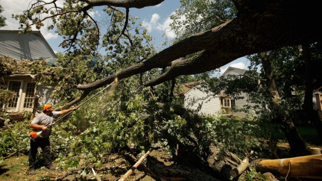 Leveled trees are cleared from an area of Silver Spring, Maryland, on July 2, 2012. An outbreak of thunderstorms and high winds that rolled through Central, Eastern, and Northeastern states June 29 through July 2 last year caused an estimated $2.9 billion in losses.