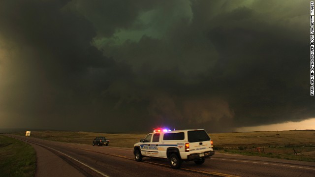 Dark storm clouds producing rain, hail and lightning move east of Calhan, Colorado, on June 7, 2012. Severe storms and damaging hail hit Colorado, New Mexico and Texas in June 2012, causing about $2.6 billion in damage.