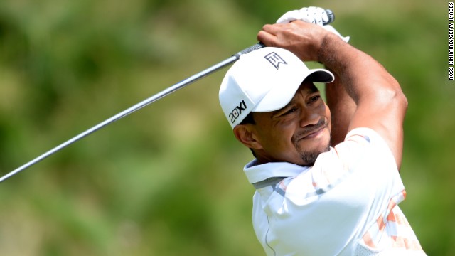 Tiger Woods, bidding for a first major in five years, shot a par 70 in the second round at tricky Merion. 