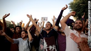 Hassan Rouhani\'s supporters in Tehran celebrate his victory.