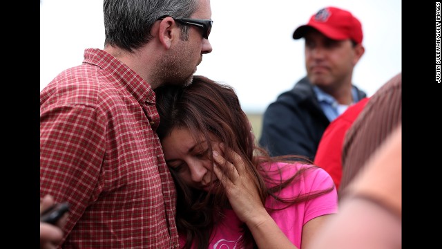 Bonnie Kruse hugs her husband, James Kruse, at a press conference in Colorado Springs on June 14.