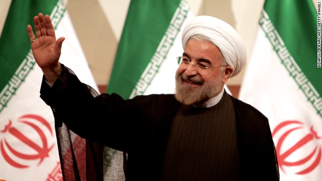 Iranian President-elect Hassan Rouhani waves at a news conference in Tehran on Monday, June 17. Rouhani, a cleric and moderate politician, took more than 50% of the vote after campaigning on a platform of "hope and prudence," appealing to both traditional conservatives and reform-minded voters.