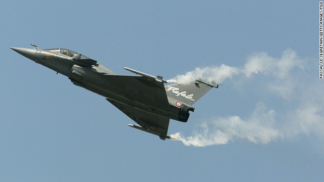 Aircraft fighter, Rafale, of Dassault Aviation company is seen during a flying display above Le Bourget airfield on the opening day of the Paris airshow in 2003. 