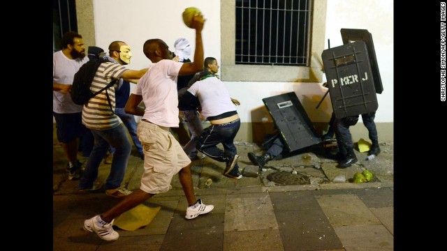 Protesters clash with riot police in front of Rio de Janeiro's Legislative Assembly building on June 17.