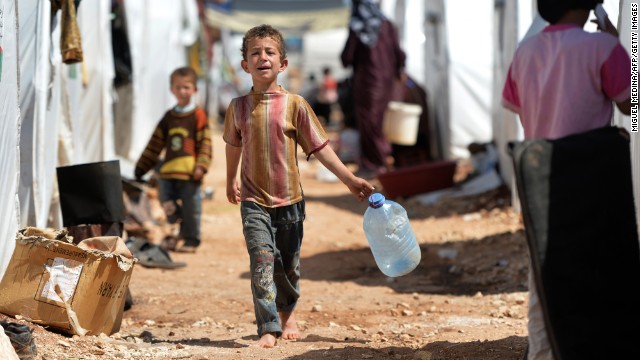 A boy carries a jug for water at the Maliber al-Salam refugee camp on April 28. The camp, located near the Turkish boarder, houses internally displaced Syrian families.