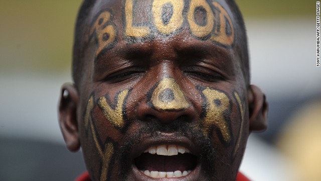 A man with the words "Blood Ivory" painted on his face protests in Nairobi with a group called Kenyans United Against Poaching.