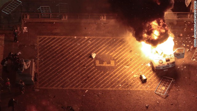 A press car burns in front of Sao Paulo City Hall on June 18.