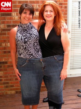 Ritchie, left, and Moyer try on a pair of Moyer's "before" jeans -- size 28 -- on Father's Day. The two friends have lost more than 280 pounds together in 2½ years.