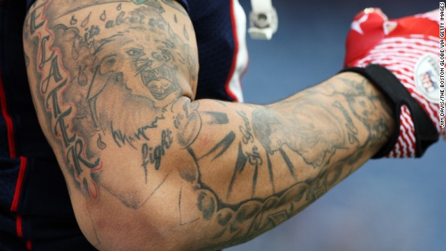 Tattoos on Hernandez's arm are visible during the pregame warmup on December 4, 2011.