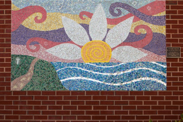 A mosaic in memory of Lauren Astley hangs at her alma mater, Wayland High School.