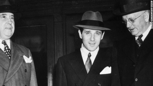 Benjamin "Bugsy" Siegel, at center with two unidentified men, established crime syndicate-controlled gambling in Las Vegas.