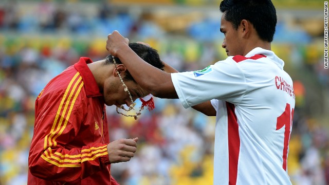 Before the game Tahiti's players presented each man in the Spanish squad with a necklace. Here, Steevy Chong Hue puts one round the neck of Cesar Azpilicueta.