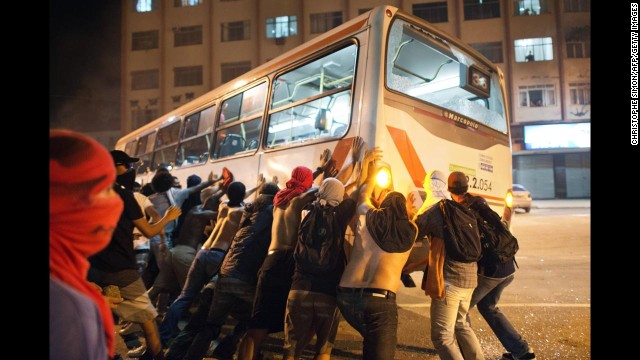 Protesters overturn a bus in Niteroi on June 19.