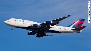 A Delta Boeing 747 similar to this one and a Shuttle America Embraer E170 passed alarmingly close on June 13, the FAA said. Both planes landed safely.