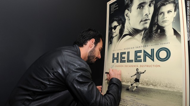 Actor Rodrigo Santoro signs a poster for the film "Heleno", in which he plays the mercurial striker. A destructive personality, together with illness and drug problems prevented Heleno from becoming one of Brazil's greatest ever players. But he helped pave the way for some of the world's greatest soccer icons...