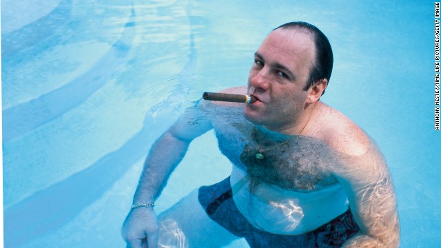 James Gandolfini, as Tony Soprano, smokes a cigar while he stands in pool, in a 1999 publicity still for the HBO's series 'The Sopranos.