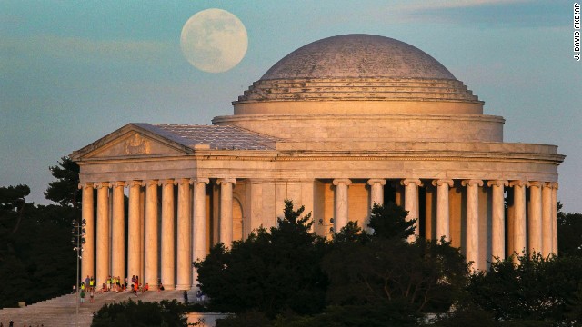 A full moon rises behind the Jefferson Memorial in Washington on June 22. 