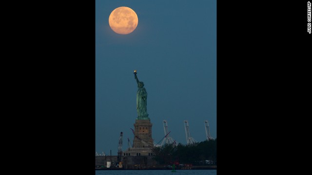 The Supermoon is seen over the Statue of Liberty on June 23 in New York. 