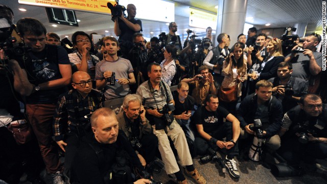 Journalists wait for any sign of Snowden or those who are trying to help him in front of the airport on on June 23, 2013. He has not been spotted yet.