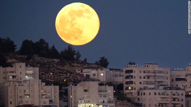 The biggest and brightest moon of the year rises over a Jerusalem neighborhood on Sunday, June 23. The magic moment happened early June 23 when the moon was at the closest point to Earth in its orbit. A supermoon, which occurs once a year, is 14% larger and 30% brighter than most full moons, according to NASA.