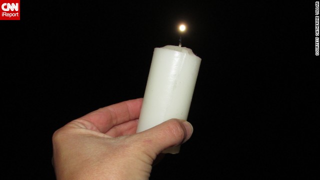 <a href='http://ireport.cnn.com/docs/DOC-993490'>Catherine Villar </a>was standing on the terrace of her home in Montevideo, Uruguay, when she saw the supermoon. She got a little creative, and placed a candle under the moon before photographing it. "I used (a candle) because I thought about the brightness of the Supermoon like a candle flame. The Supermoon shines like fire," she said. 