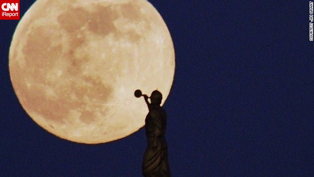 <a href='http://ireport.cnn.com/docs/DOC-993775'>Jim Grant </a>photographed the supermoon in the La Jolla area of San Diego. "When I saw the moon rising, I thought I might have a good chance to get the trumpet player in the frame. So I pulled off the freeway into a shopping center and drove around looking for just the right angle," he said.