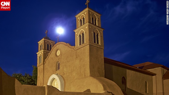 <a href='http://ireport.cnn.com/docs/DOC-993711'>Cory Boehne</a> was lying on the pavement in Socorro, New Mexico, when he photographed the supermoon. 'It was a great night for it. A perfect desert evening with temperatures in the high fifties and just a light bit of wispy cloud cover. I went out for a bike ride by the moonlight, looking for just the right shot. The church here is a major focal point, and has been since the town has existed, so naturally it is a great subject," he said. 