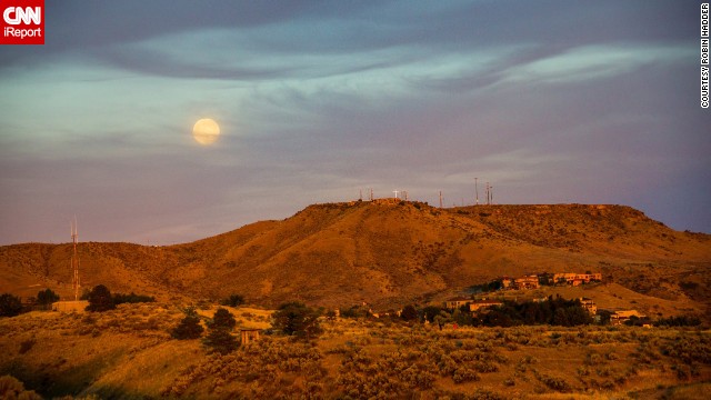 <a href='http://ireport.cnn.com/docs/DOC-993732'>Robin Hadder</a> hiked into the foothills of the Boise Mountains in Idaho and used a compass to estimate where the supermoon would rise. "Looking up and seeing the moon is not a unique experience as a human being, but photos always bring an emotional response. Perhaps it is because of the symbolism of the moon in every culture throughout time. Such a large moon, in frame with landmarks that define a city or region, can be awe-inspiring," she said. 