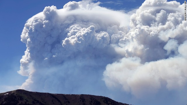 Plumes of smoke rise above Del Norte Peak in Colorado on Sunday, June 23. Fires have been burning across Colorado since early June.