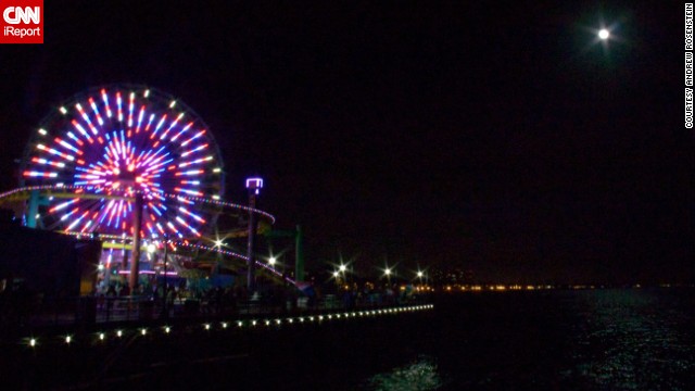 <a href='http://ireport.cnn.com/docs/DOC-994249'>Andrew Rosenstein </a>was standing on the Santa Monica pier in California when he photographed the supermoon shining brightly next to a neon-colored ferris wheel. "I find it to be an important endeavor of science to understand the universe around us," he said.