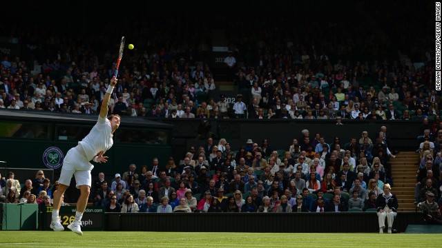 Britain's Andy Murray serves against Germany's Benjamin Becker during their first-round match on the first day of the Wimbledon Lawn Tennis Championships in London on Monday, June 24.