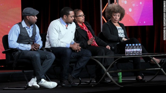 From left, Kweli, filmmakers Shukree Hassan Tilghman and Sharon La Cruise and activist Angela Davis at a Black History Month panel last year. The rapper often addresses the plight of African-Americans in his songs, once rhyming, "N****s with knowledge is more dangerous than n****s with guns/They make the guns easy to get and try to keep n****s dumb."