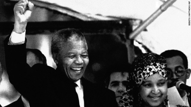 Mandela and his wife react to supporters during a visit to Brazil at the governor's palace in Rio De Janeiro, on August 1, 1991.
