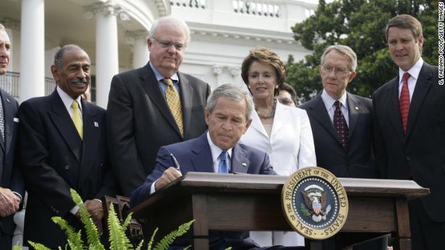 President George W. Bush signs reauthorization of the act on July 27, 2006. From left, Rep. John Conyers, D-Michigan, Rep. James Sensenbrenner, R-Wisconsin, House Minority Leader Nancy Pelosi, D-California, Sen. Harry Reid, D-Nevada, and Sen. Bill Frist, R-Tennessee, look on.