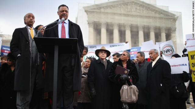 The Rev. Jesse Jackson, at the microphone, and the Rev. Al Sharpton, left, deliver remarks during a rally outside the U.S. Supreme Court on February 27, 2013, as the court prepared to hear oral arguments in Shelby County v. Holder, the legal challenge to Section 5 of the Voting Rights Act. 