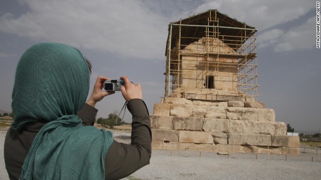 A visitor takes a picture of the limestone tomb of ancient Persia's King Cyrus the Great, near the modern city of Shiraz