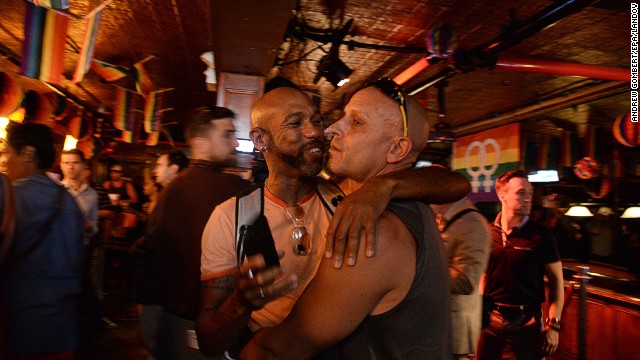 Patrons of the Stonewall Inn in New York gather to hear the Supreme Court rulings.