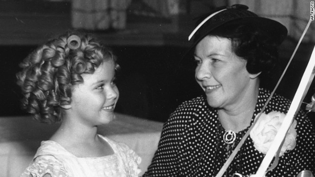 Shirley Temple celebrates her birthday in 1936 with her mother, Gertrude Temple. Her mother, recognizing her daughter's "it" factor, enrolled Shirley in dance classes at age 3. She landed her first film contract at the same age, and soon became one of the earliest and most successful child stars. The actress, now 85, went on to become a U.S. diplomat for the United Nations.