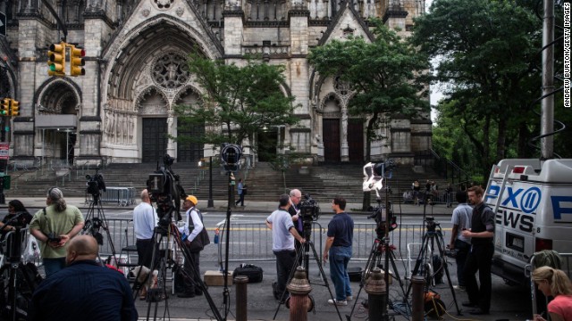 Members of the media congregate outside the Cathedral Church of St. John the Divine in New York City prior to the funeral of James Gandolfini on Thursday, June 27.