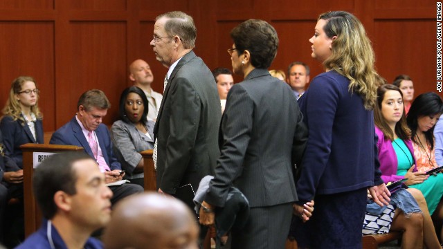 From left, Zimmerman's father, Robert Zimmerman Sr.; his mother, Gladys; and his wife, Shellie, are escorted from the courtroom on June 24. Since they are all on the witness list, the judge ruled they cannot be present in the courtroom until after they testify.